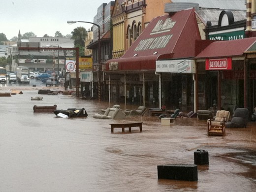 Furniture and debris being washed out onto the streets by flash flooding in Toowoomba.