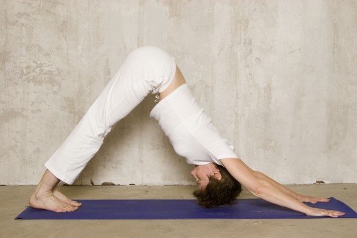 Downward Facing Dog lifts the hips above the heart and flushes toxins from the organs.