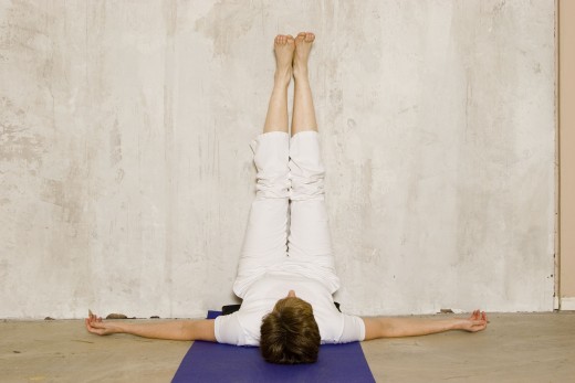 Legs Up the Wall is an easy variation of shoulderstand.  If it is comfortable, elevate the hips on a bolster to create a gentle abdominal inversion, and relax here for five minutes.