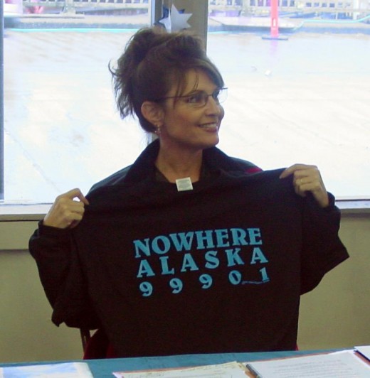 Sarah Palin holding a T-shirt related to the Gravina Island Bridge