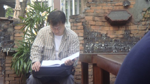 This is the man that checks paperwork and attends to the business details.