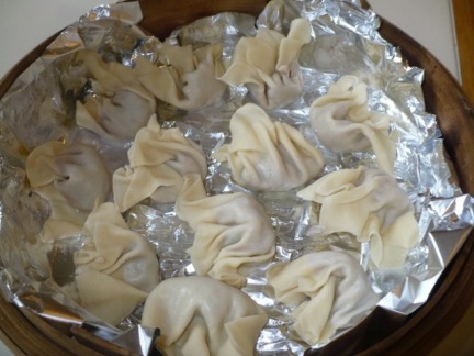 Spread them out on a bamboo steamer and you're on your way. Spray the aluminum foil with a little Pam or oil it a little, so you don't end up with broken dumplings. 