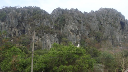 A white budha statue from afar.