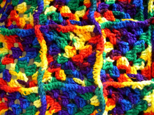Different yarn colors together for a multi-colored crochet piece.