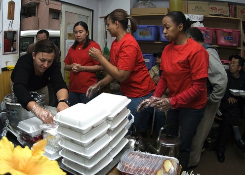 US Navy helping serve food to homeless in Japan.