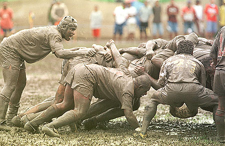 A rugby union scrum in the mud