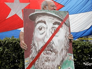 Feb. 19: Alfredo Rey carries an anti-Castro poster in the Little Havana neighborhood in Miami as Cuban-Americans celebrated the news of Fidel Castro's resignation