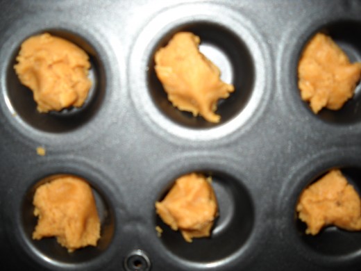The bottom layer of the peanut butter cup before the chocolate chips have been added.