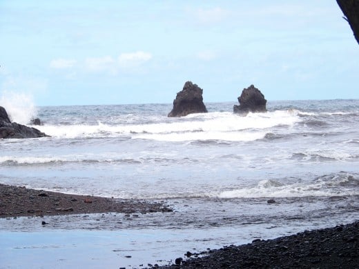 A couple lonely boulders in the ocean that had broken away from land