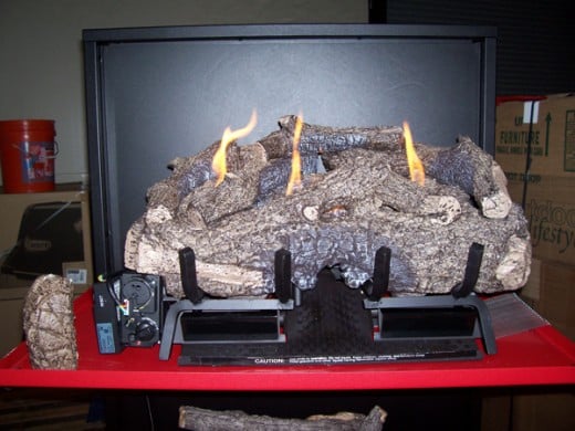 ceramic logs placed on the g10 vent free gas fireplace realfyre burner.