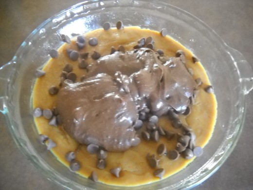 Brownie batter poured on pressed cookie dough.