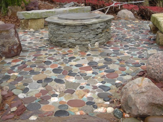 Fire pit laminated with left over blue stone from walkway and river stone acquired from Rt. 23 Patio in Sussex and some hand picked from the Delaware River.