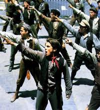 Scene from the Disney musical Newsies. Front and center is the main character Jack Kelly played by Christian Bale.