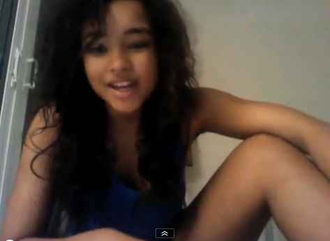 Jessica Jarrell sitting at home singing into a camera