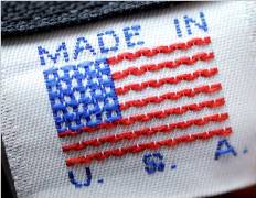 embroidered clothing label in red white and blue with the American flag and the words Made in the U.S.A.
