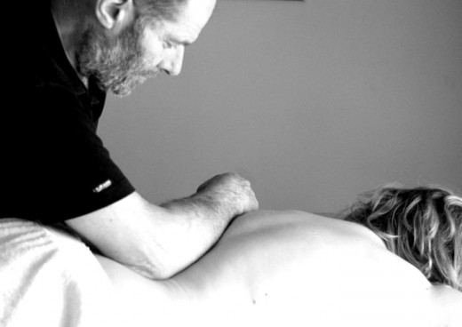 Easing tight back muscles with deep massage.