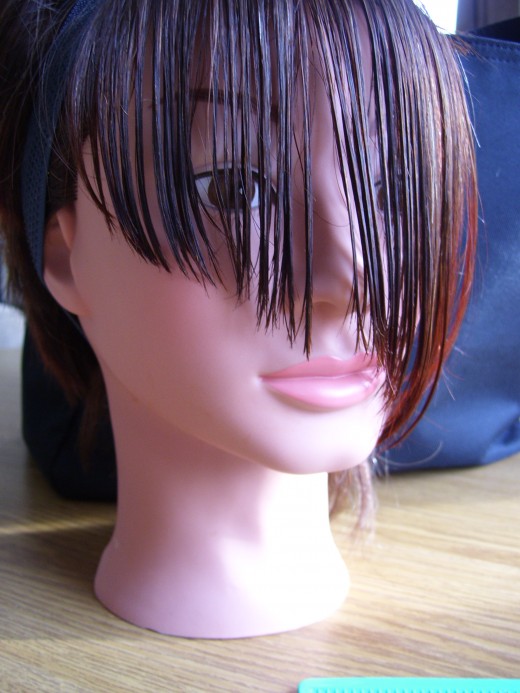 Long fringe bang after cut, and hanging straight down.
