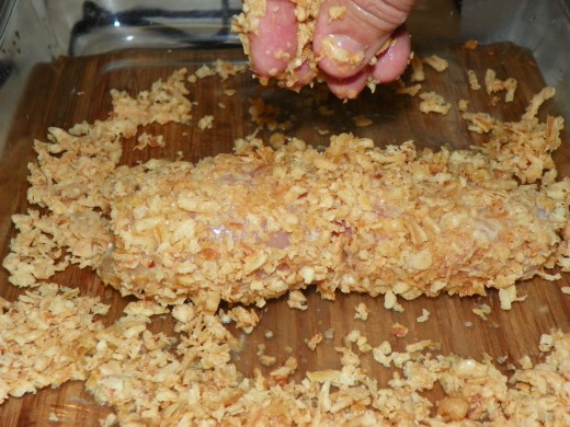 Roll egg covered breast in fried onion mixture, make sure you have added melted butter to to fried onions to insure proper browning while in the oven.