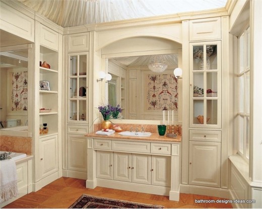 white bathroom cabinets with extensive use of glass front cabinets