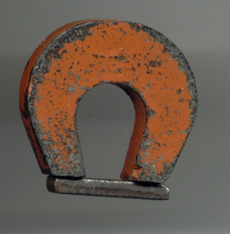 A horse shoe permanent magnet made up of alnico.