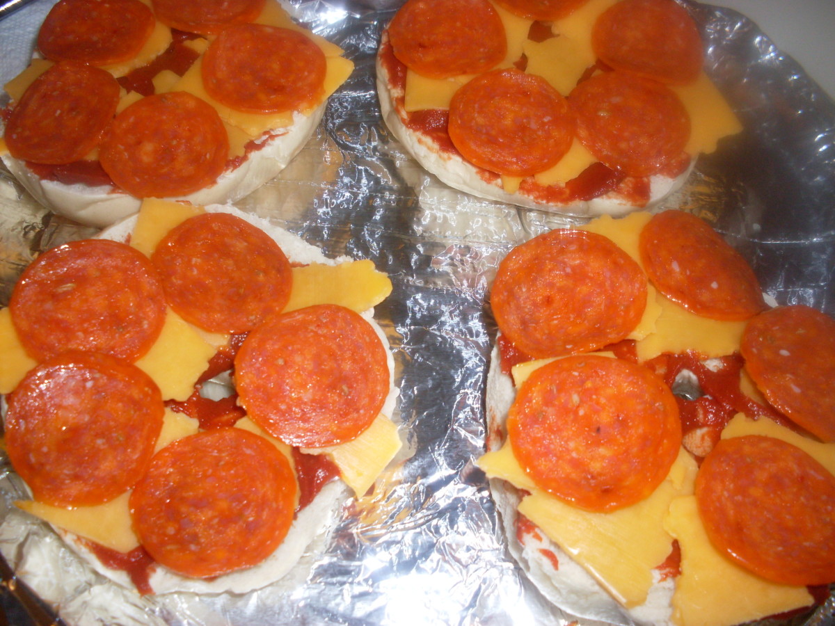 Pizza bagels with pepperoni, prepared to go into the oven