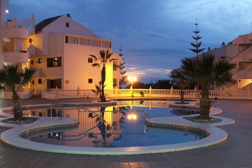Paloma Beach Apartments pool at night