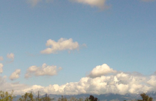 Fluffy clouds above the San Bernardino Mountains.