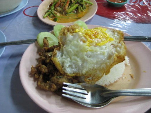 Fried pork over rice with fried egg