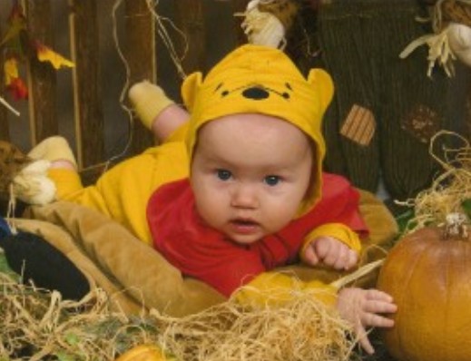 My youngest daughter on her first Halloween in 2007, wearing the same Winnie the Pooh costume that was first worn by her brother in 1994, her sister in 1995, and most recently by my nephew on his first Halloween in 2010.