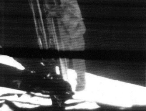 Neil Armstrong descending the ladder on the lunar module. Polaroid image of slow scan television monitor at Goldstone Station. Nasa image S69-42583.mage via Wikipedia