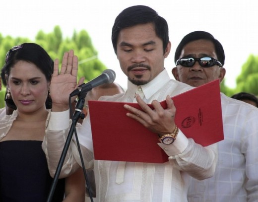 Manny Pacquiao takes his oath of office Image source: http://www.philippinestodayus.com/wp-content/uploads/2010/07/pacquiao1.jpg