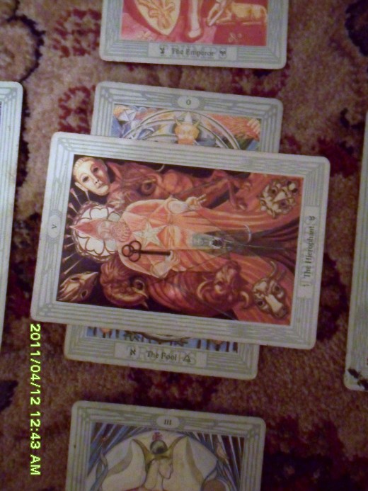 A closer view of the first two cards, myself in the current situation and the horizontal card representing barriers, difficulties to over come 