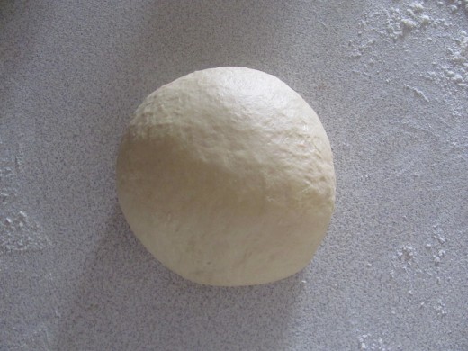 What your dough should look like after you have kneaded it and it is ready for its first rising. 