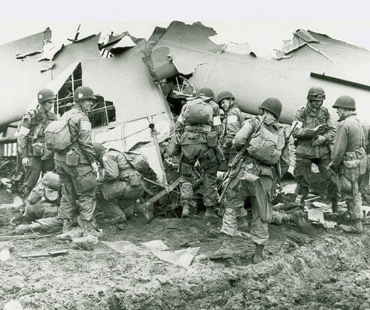 Members of the 101st Airborne inspecting a plane wreck. Easy Company wast part of the 101st Airborne.