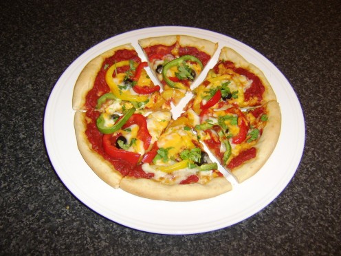 Mixed bell peppers and black olive pizza