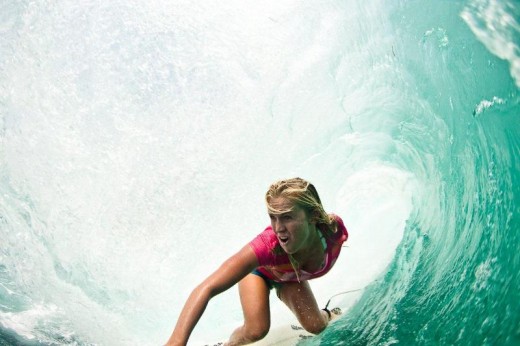 Bethany surfing through a "tube" also referred to as the "green room" by surfers