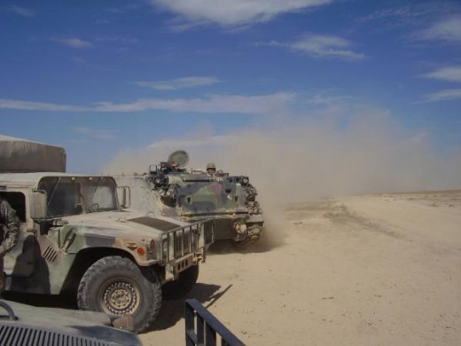 Humvee and APC. You don't know dust until you've driven behind an APC in Gowen Field.