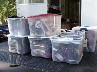 Carry supplies in containers. They're much easier to move this way.