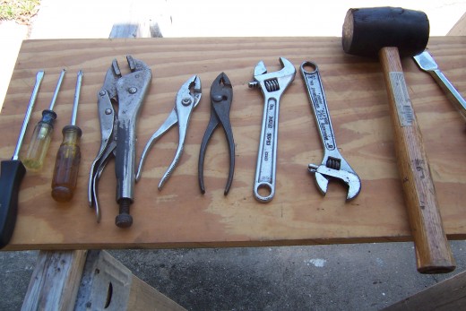 Screw Drivers, Pilers, Vise Grips, Adjustable wrenches, rubber mallet   