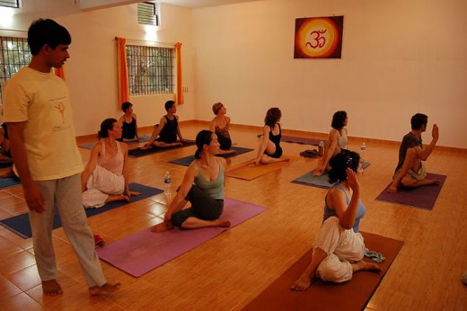 This is Ardha Matsyendrasana Yoga Pose - various trained teachers from Indian Yoga Institutes have been setting up their yoga institutes in other parts of the world.