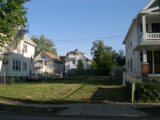 My childhood friend's home is no longer standing. (My mom still lives in the house on the right.)