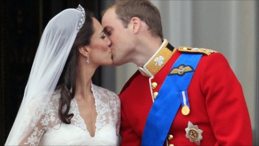 Prince William and his new bride, Kate Middleton, kiss on the balcony of Buckingham Palace