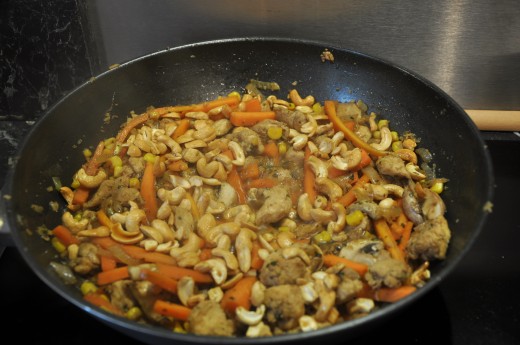 The mix being cooked in a wok