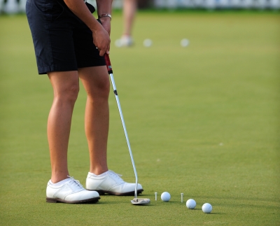 Woman enjoying golfing