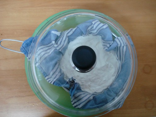 Yogurt being sieved. Note it is covered