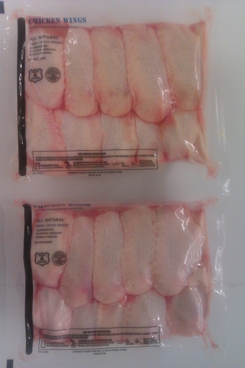 Chicken wings in a Cryovac bag.