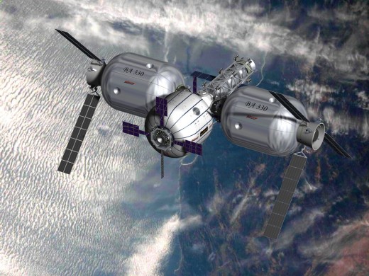 Artist's conception of the first planned commercial space complex by Bigelow Aerospace. The complex includes the Sundancer module, planned for launch in 2010, docked with a propulsion bus and node to be launched in 2011. Connected to that backbone ar
