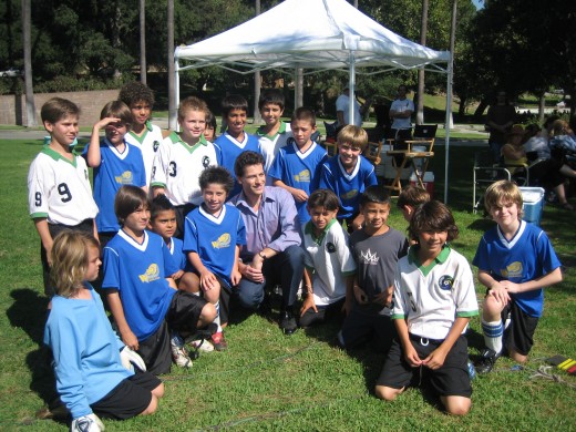 Child actors working with Ioan Gruffudd on a soccer scene for the movie, The TV Set."