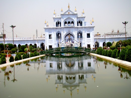 The reflection of Chhota Imam Bargah in the central water-body as per  the "Charbag" style of Mughal architecture