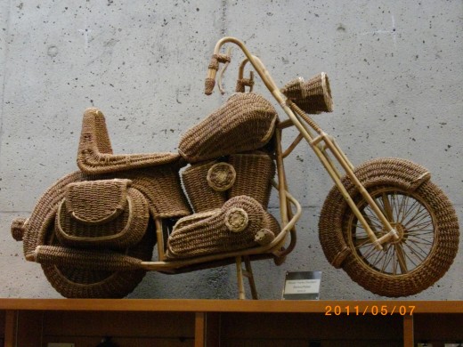 Here is an um image that could be a cargo cult representation by someone who saw a motorcycle but lacked the understanding of its real design and workings. This is a straw woven image of a motorcycle. This was found at the UBC museum of anthropology,